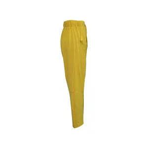 Side view of yellow casual harem pants with comfortable elastic waistband detail.