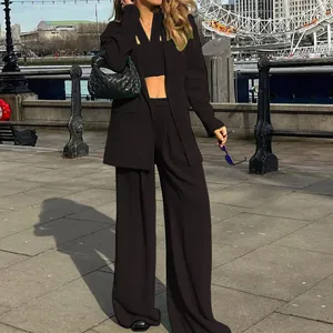 Elegant black three-piece suit set including blazer, crop top and wide-leg trousers