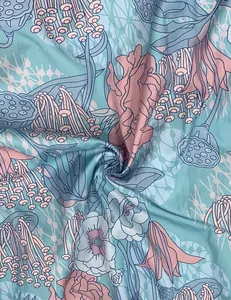 Detailed close-up of botanical floral print fabric in blue and pink for summer dresses