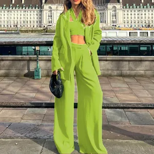 Elegant lime green three-piece suit set featuring a tailored blazer, crop top and wide trousers