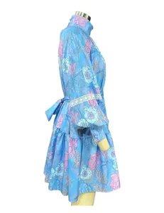 Side view of elegant floral high-neck puff sleeve dress with delicate white lace trim detail