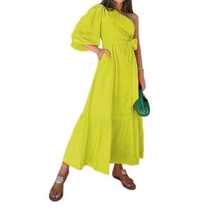 Full length view of a vibrant lime yellow one-shoulder cotton linen dress on a model