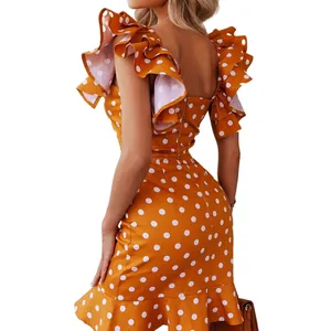 Detailed back view of a vibrant orange polka dot mini dress featuring ruffle butterfly sleeves