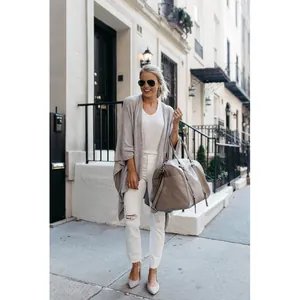 Casual grey longline knitted cardigan featuring an irregular hem for autumn street style