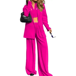 Full body view of a stylish fuchsia three-piece blazer and wide-leg trouser suit set
