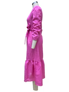 Side view of vibrant pink cotton-linen midi dress with ruffled hem and waist tie