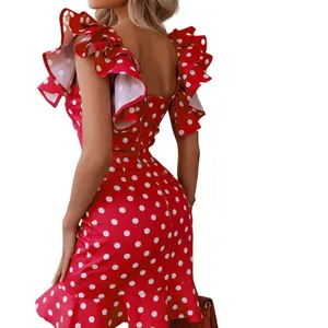 Close-up detail showing the ruffle sleeves and back design of a red polka dot mini dress