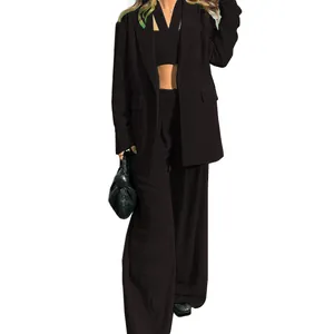 Detail view of 3-piece chic black blazer set with crop top and wide leg pants