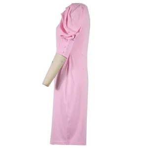 Detailed side view of an elegant pink puff sleeve dress with chic button cuffs for women