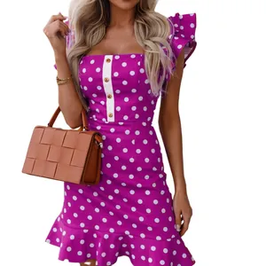 Close-up of purple polka dot mini dress with ruffle flutter sleeves and white button detail