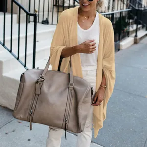 Stylish loose mid-length knit cardigan with irregular hem in beige finish for women