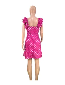 Detailed back view of a pink polka dot mini dress with stylish ruffle sleeves on mannequin