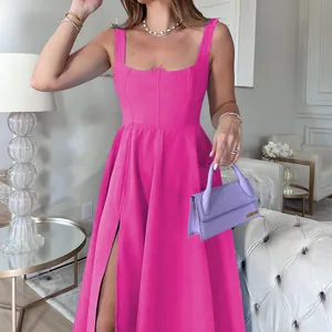 Detail of a hot pink corset midi dress with a high leg slit, stylish summer fashion look
