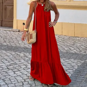Elegant red sleeveless halter neck maxi beach dress for women in a sunny outdoor setting