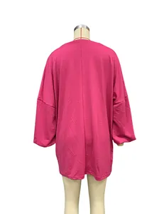 Back view of a vibrant pink oversized crewneck sweatshirt with drop shoulders