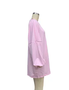 Pink oversized long-sleeved sweatshirt for women shown on a side-view mannequin stand