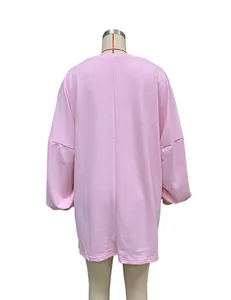 Detailed back view of a pink mid-length oversized sweatshirt featuring a drop shoulder design
