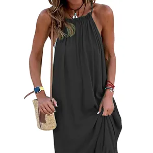 Sleeveless halter maxi beach dress in black with flowy design and ethnic accessories