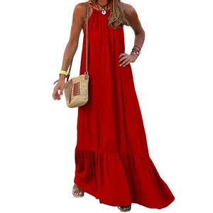 Full length view of a vibrant red sleeveless halter neck long flowy beach maxi dress.