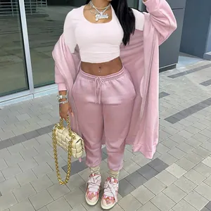 Detailed view of women's casual pink two-piece tracksuit set including hoodie and joggers