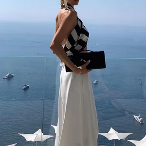 Elegant white wide-leg pants for women featuring a flowy vacation-style design