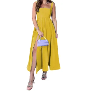 Full view of yellow camisole dress showing the high leg slit and fabric drape detail