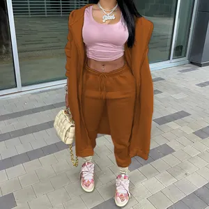 Detailed view of trendy women's long hoodie and sweatpants set in caramel brown finish