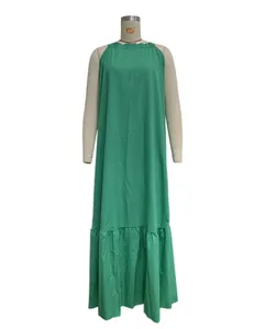 Detail of green sleeveless halter maxi beach dress on a mannequin