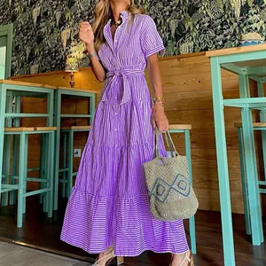 Detailed view of a purple striped tiered maxi dress with waist tie and short sleeves