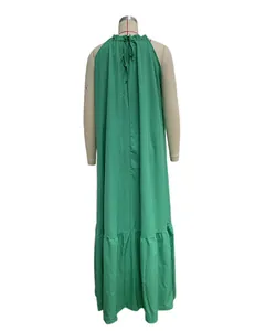Detailed back view of a vibrant green sleeveless halter maxi beach dress for women