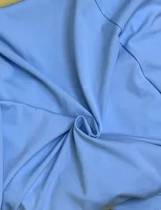 Detailed macro view of light blue soft fabric for summer solid midi camisole dress