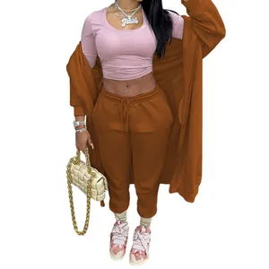 Casual women's sportswear set featuring long brown hoodie and matching drawstring pants