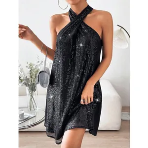 Close-up detail of sexy black sequin halter neck dress for summer cocktail parties