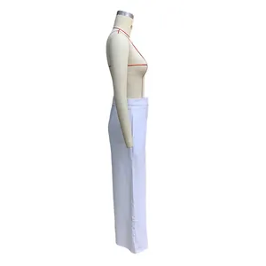 Detailed side view of elegant white high-waisted wide-leg trousers on a display mannequin