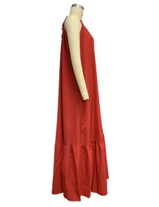 Side view of elegant red sleeveless halter long beach dress with tiered hem detail