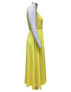 Side profile detail of a bright yellow summer maxi dress shown on a white mannequin.