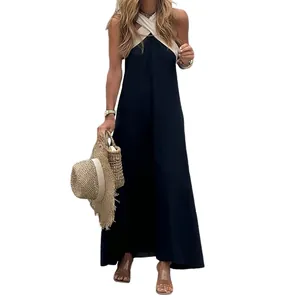 Detailed view of the elegant black halter neck maxi dress featuring contrasting cream straps.