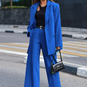 Street style view of women's vibrant blue 2-piece blazer and wide-leg trousers suit