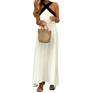 Detail of white cotton linen halter maxi dress with black cross-neck strap design