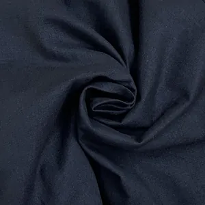 Detailed macro view of the breathable navy blue cotton linen fabric with natural texture
