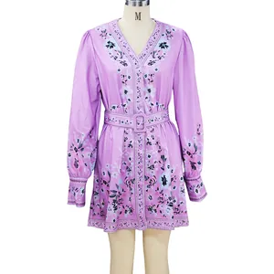 Elegant purple bohemian floral print long sleeve V-neck dress with matching belt.