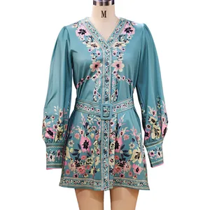 Detail of Bohemian floral print dress with long sleeves and V-neckline