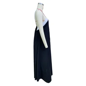 Side profile view of a solid black backless cotton linen halter maxi dress on a mannequin