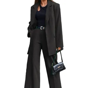 High-quality detail showing the fit and texture of the black two-piece women's business suit