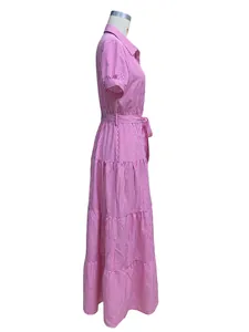 Side view of pink and white striped tiered maxi dress with short sleeves and belt