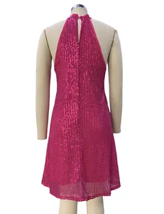 Detailed back view of a glamorous hot pink sequined halter neck cocktail dress on a mannequin.
