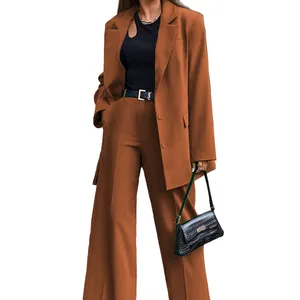 Elegant brown two-piece blazer and wide-leg trousers suit for a modern street style.