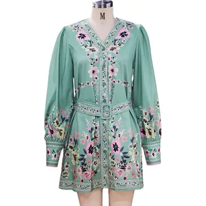 Bohemian floral mini dress with long lantern sleeves and V-neck on mannequin