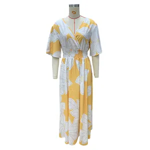 Full length view of a yellow and white floral print maxi dress with V-neck on mannequin