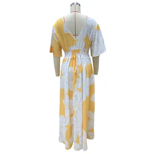 Back view of yellow floral print maxi dress with V-neck and elastic waist details
